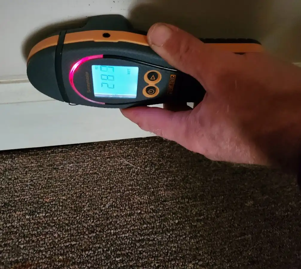 Moisture detection at baseboard during Storm Damage Restoration in Lansdale